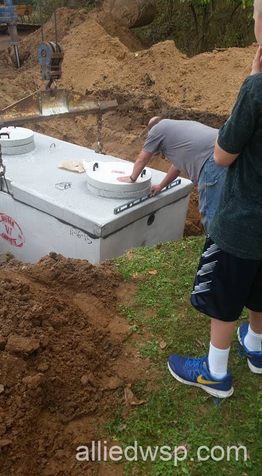 leveling septic system tank in